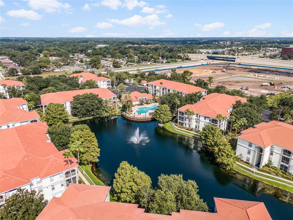 2651 Maitland Crossing Way, Unit 103 Orlando, FL 32810 - Photo 1 of 1 an aerial view of residential houses with outdoor space