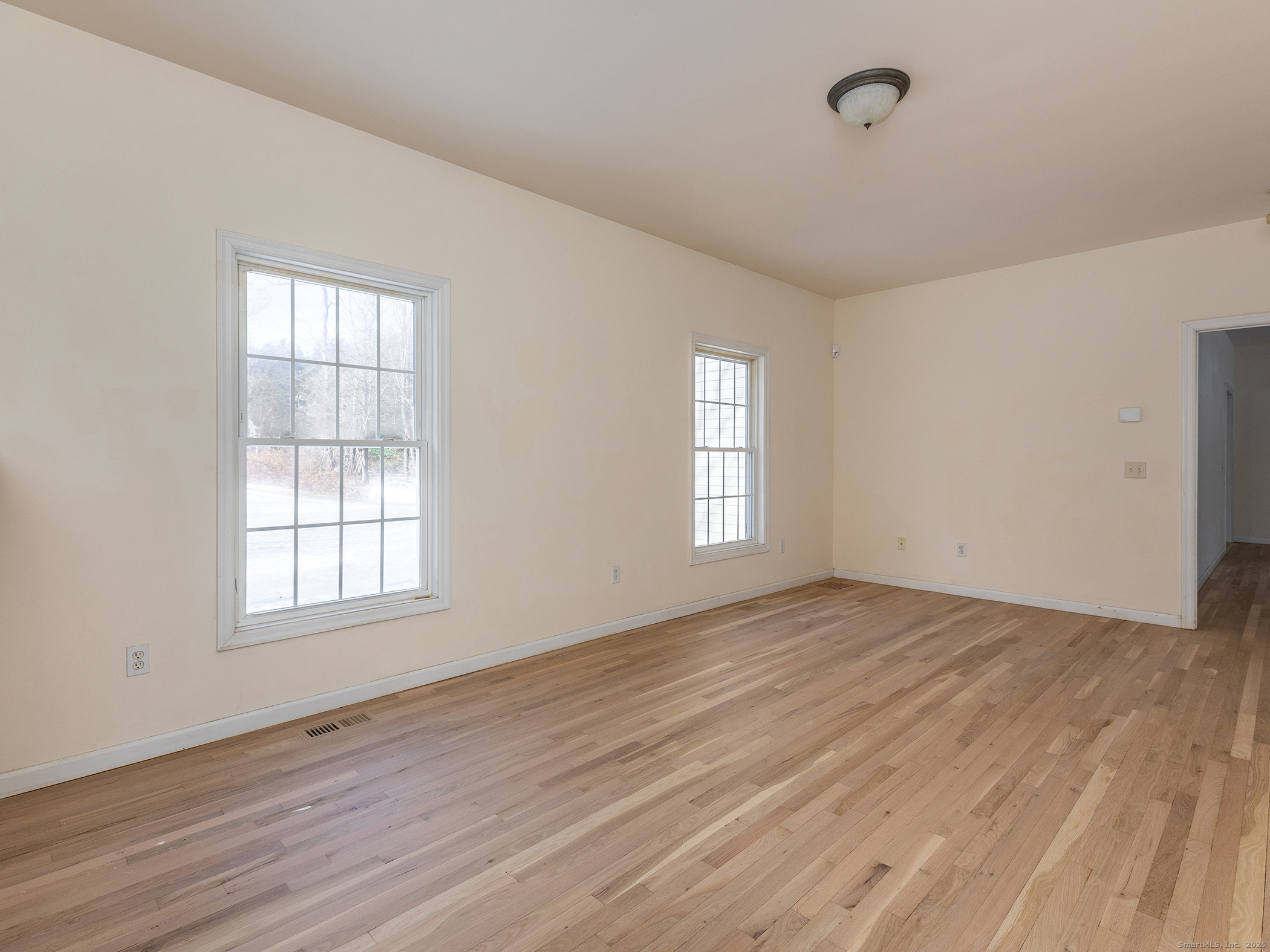 36 Sunset Lane Washington, CT 06794 - Photo 15 of 23 an empty room with wooden floor and windows