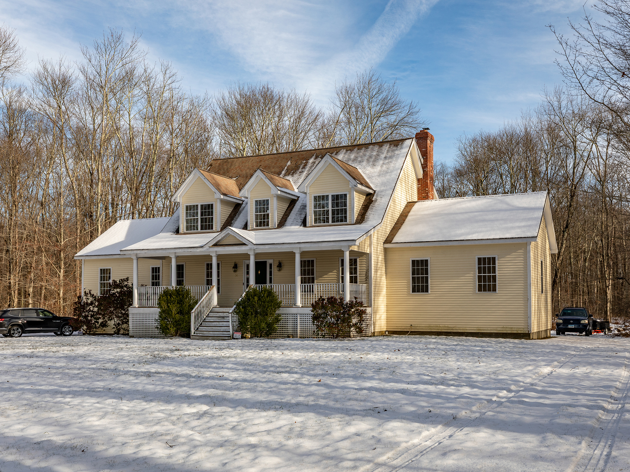 36 Sunset Lane Washington, CT 06794 - Photo 2 of 23 a view of a white house with a big yard and large trees