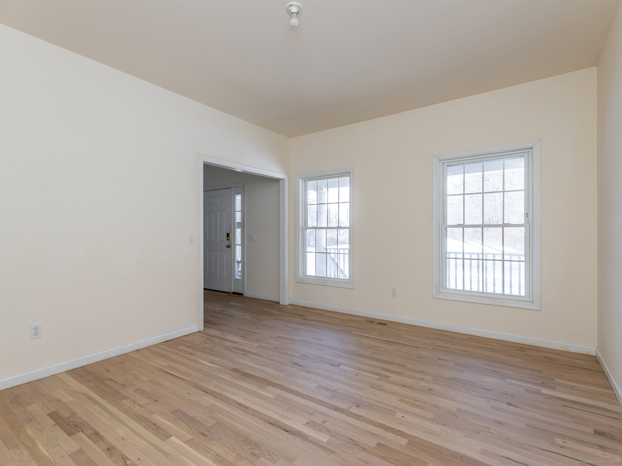36 Sunset Lane Washington, CT 06794 - Photo 6 of 23 an empty room with wooden floor and windows