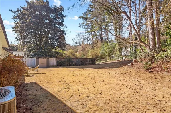 a view of yard covered with snow in front of house