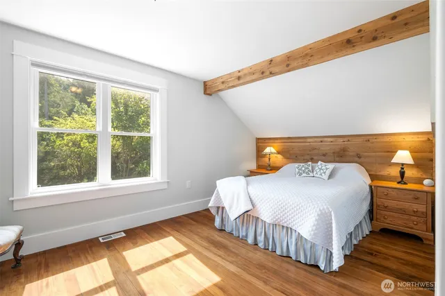 a bedroom with a bed and window