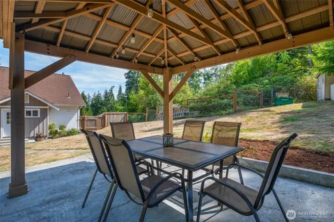 a view of an outside dining space with furniture