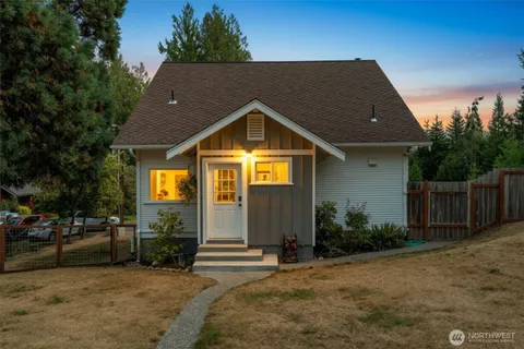 a view of a house with sitting area and garden