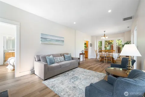 a living room with furniture and a lamp