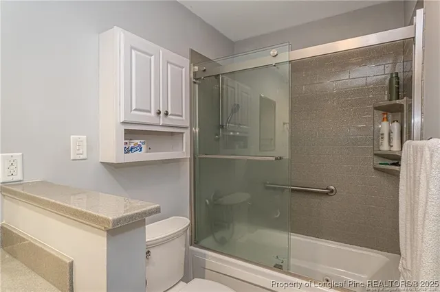 a bedroom with a large bed closet and window