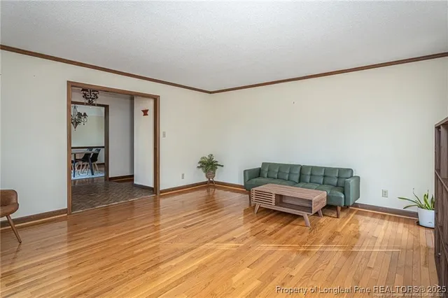 a room with furniture and wooden floor