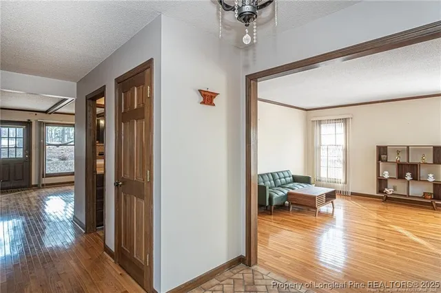 a view of a livingroom with furniture and hardwood floor