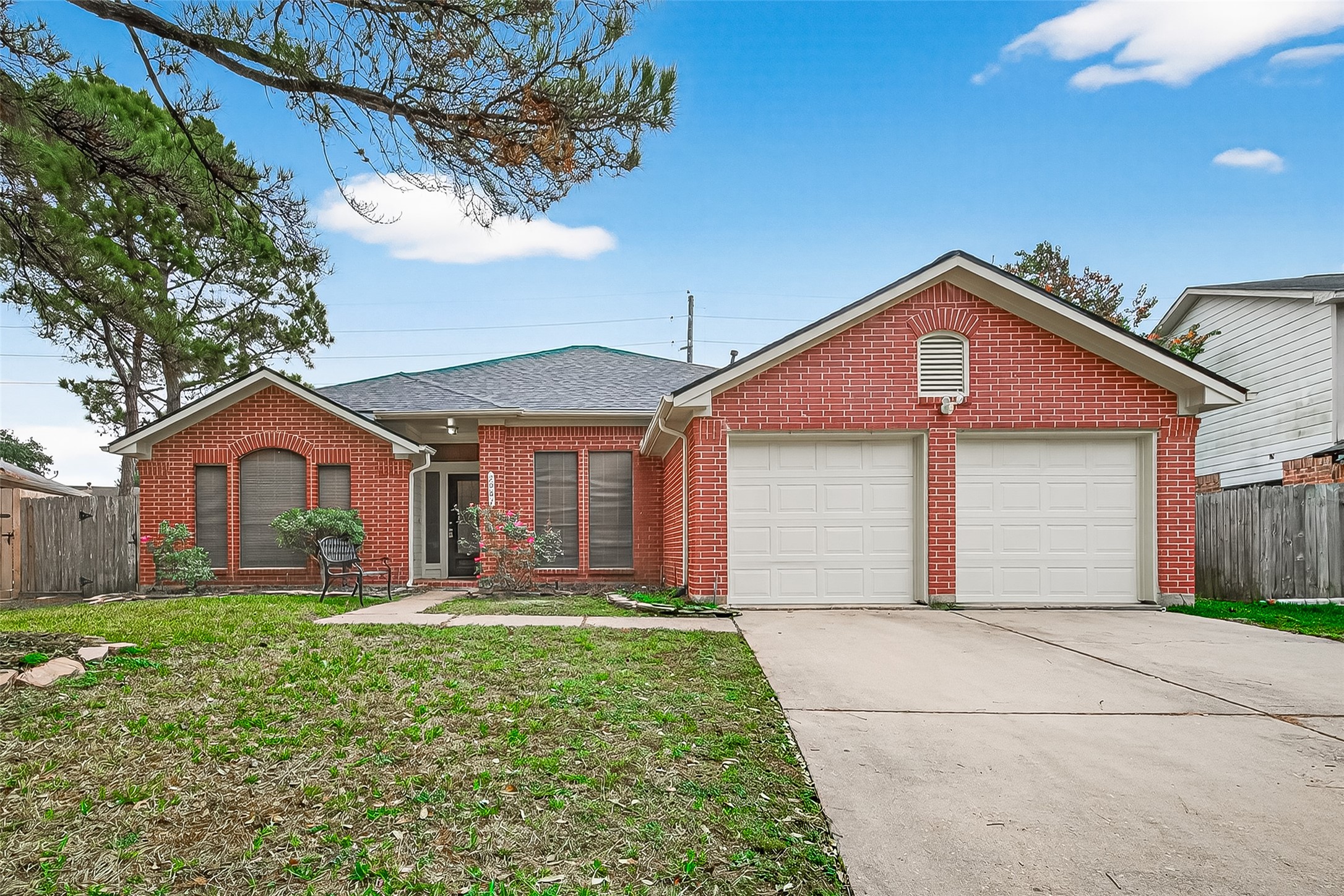 2002 Foundary Drive Katy, TX 77493 - Photo 1 of 20 a front view of a house with a yard and garage