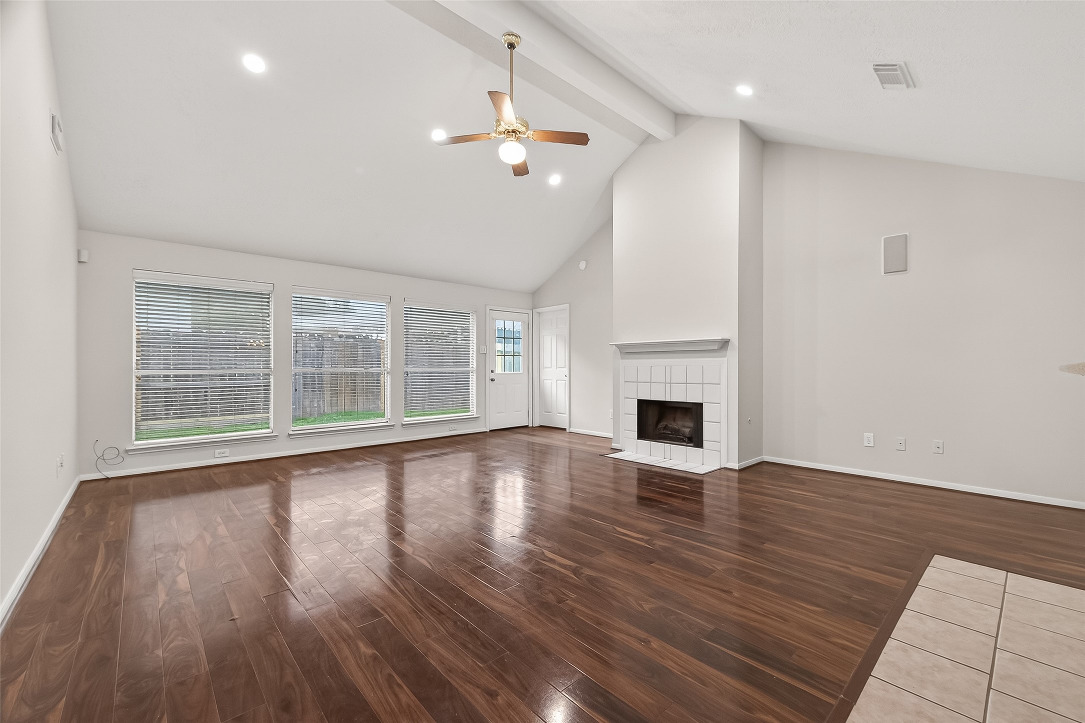 2002 Foundary Drive Katy, TX 77493 - Photo 5 of 20 a view of empty room with wooden floor and fireplace