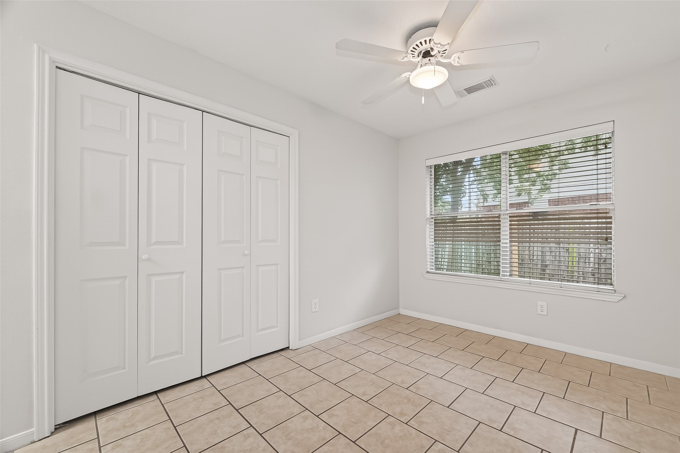 2002 Foundary Drive Katy, TX 77493 - Photo 8 of 20 wooden floor in an empty room with a window