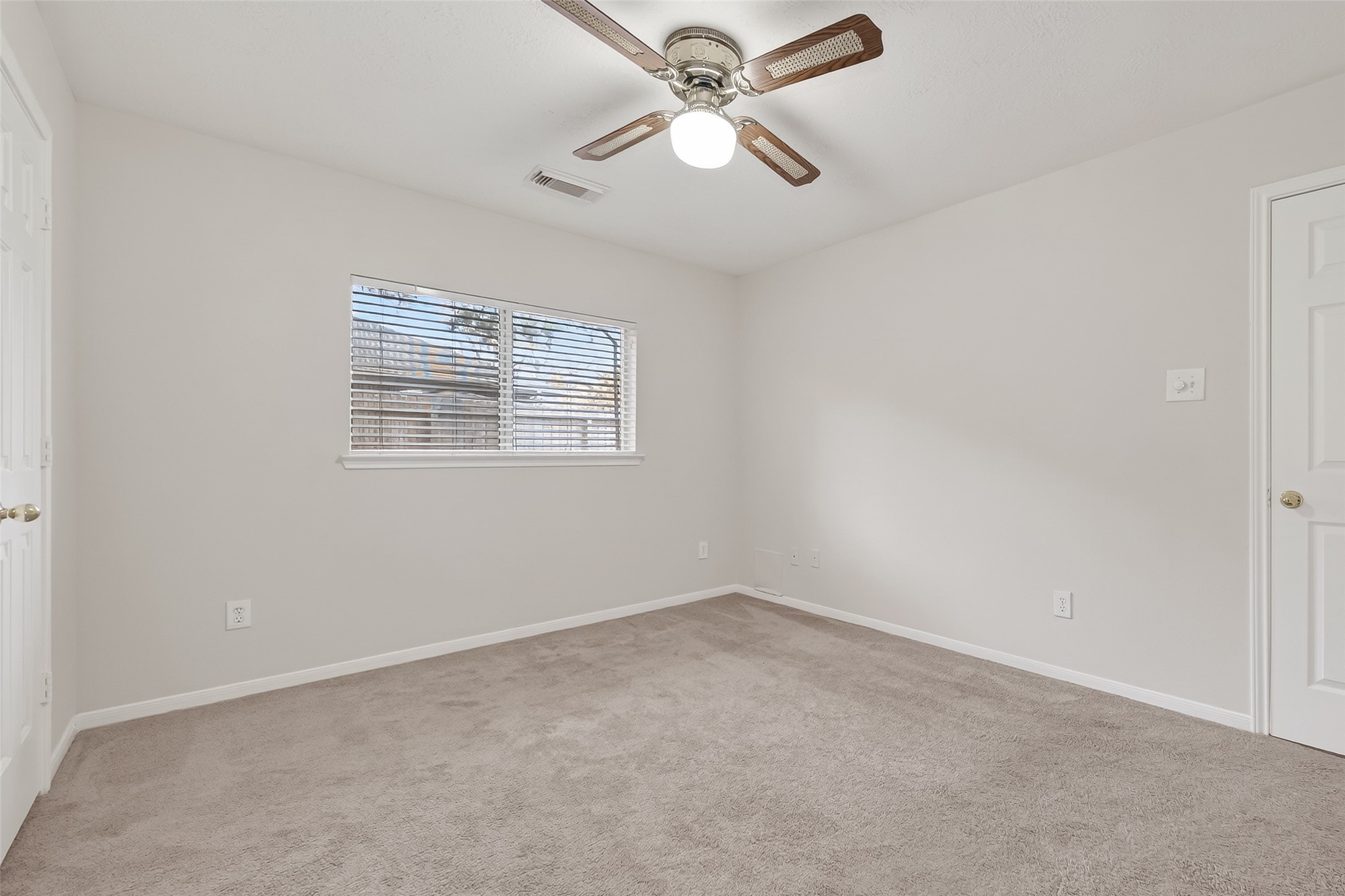 2002 Foundary Drive Katy, TX 77493 - Photo 10 of 20 an empty room with a window and ceiling fan