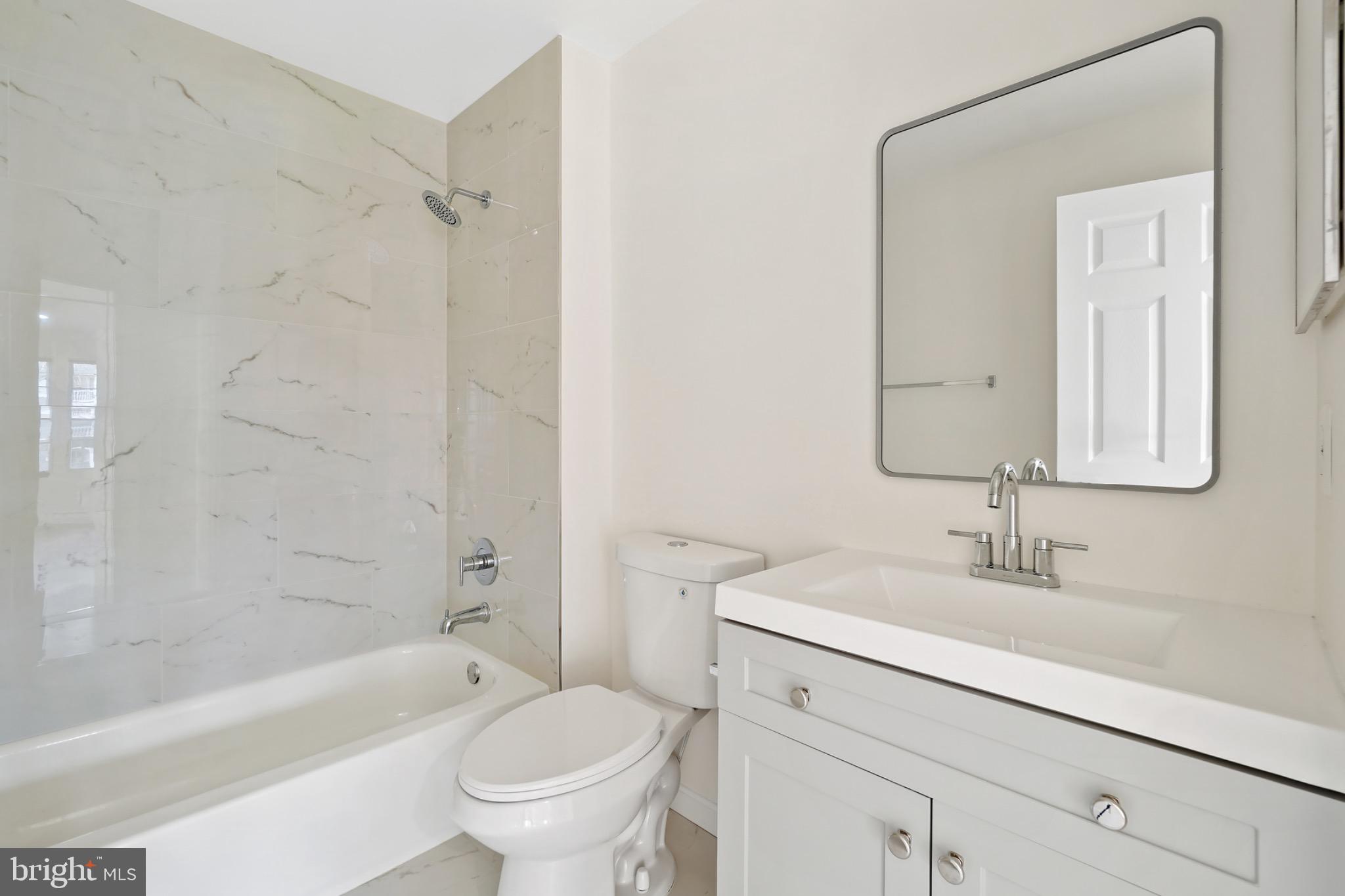 14184 Cuddy Loop, Unit 201 Woodbridge, VA 22193 - Photo 22 of 30 Sleek modern bathroom with elegant finishes.