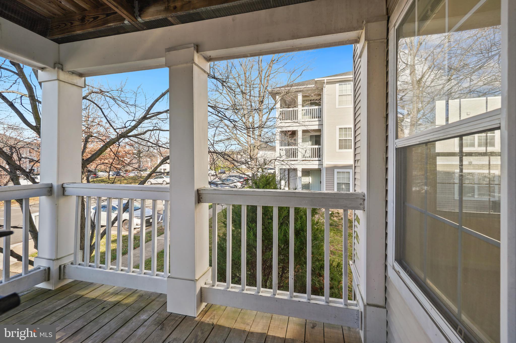 14184 Cuddy Loop, Unit 201 Woodbridge, VA 22193 - Photo 27 of 30 Serene balcony view in a vibrant community.