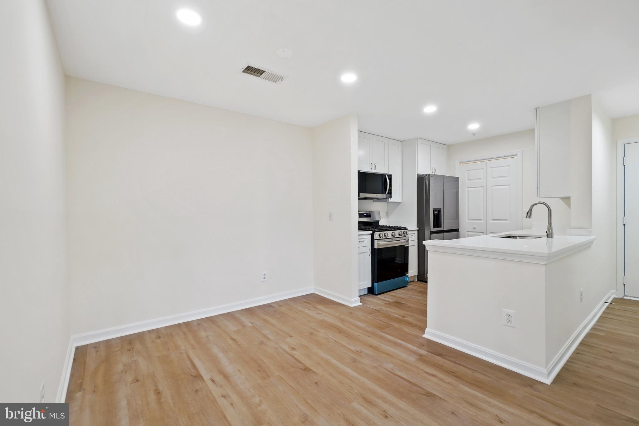 14184 Cuddy Loop, Unit 201 Woodbridge, VA 22193 - Photo 7 of 30 Modern kitchen with open layout charm.
