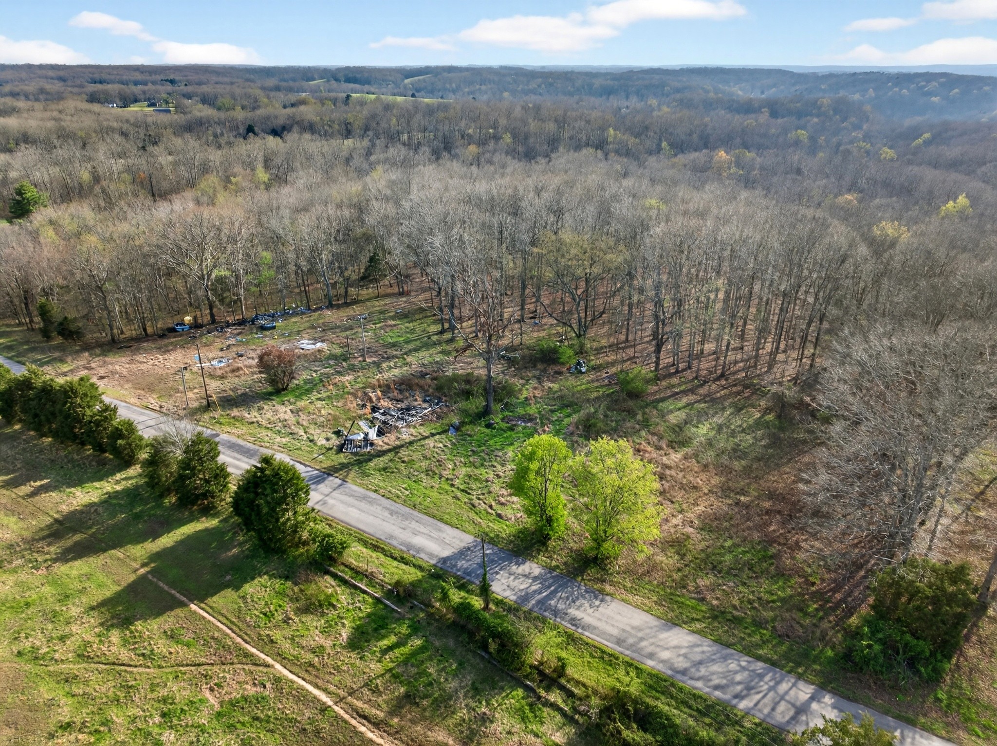 3240 Clay Tomlinson Road Erin, TN 37061 - Photo 16 of 16 a view of a yard with wooden fence