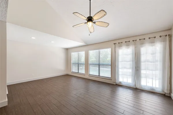 a kitchen with stainless steel appliances kitchen island granite countertop a sink a stove counter space and cabinets