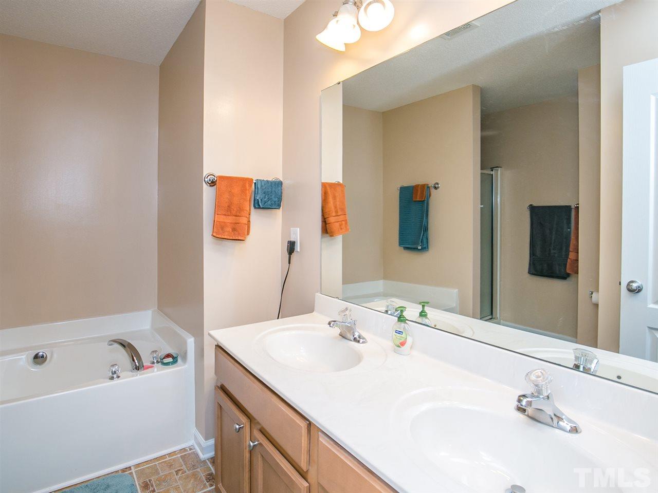 2883 Orchard Trace Way Raleigh, NC 27610 - Photo 11 of 16 Just enjoy soaking in the garden tub in your large master bath.