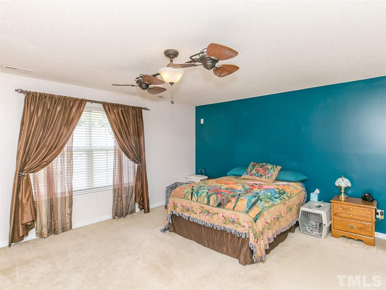 2883 Orchard Trace Way Raleigh, NC 27610 - Photo 10 of 16 Relax after a long day in your large master bedroom.