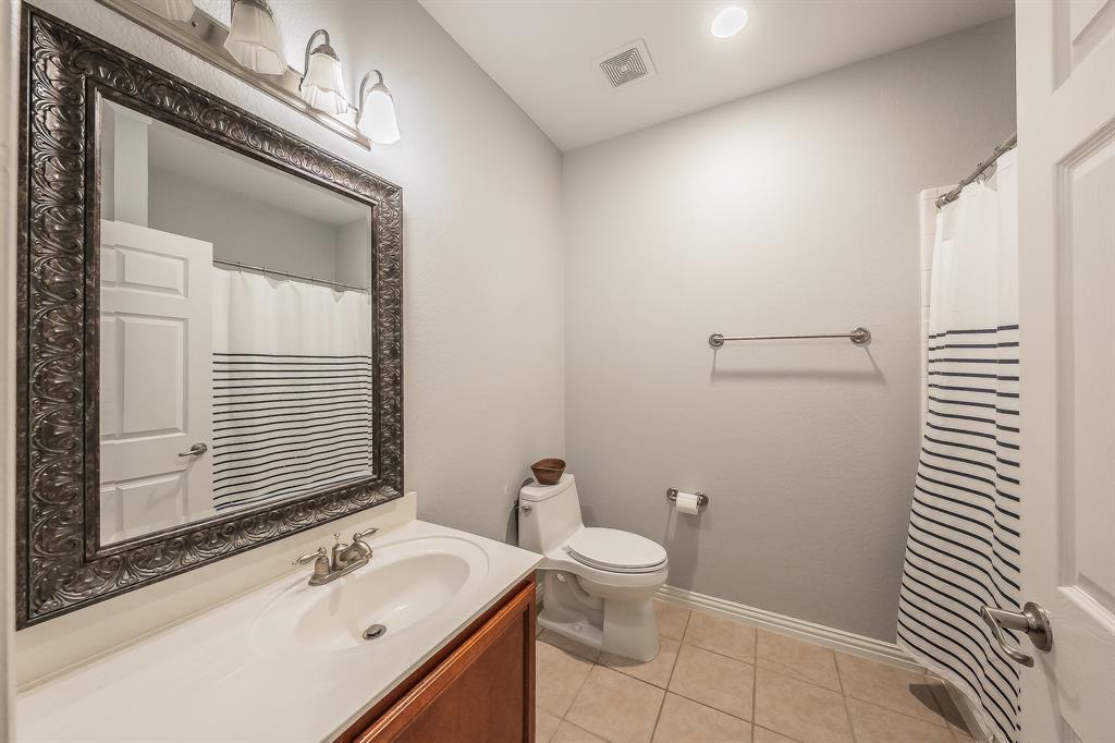 7253 Bianca Lane Plano, TX 75093 - Photo 11 of 18 a bathroom with a sink a toilet and shower