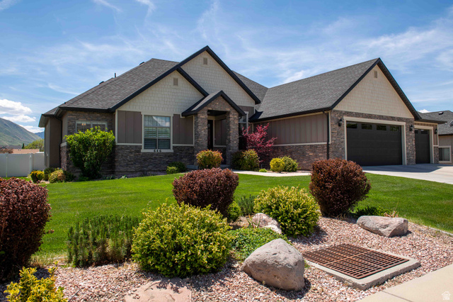 646 East 1400th Street North Mapleton, UT 84664 - Photo 3 of 78 Contemporary residence featuring stone and siding exterior, a dark shingle roof, and a two-car garage