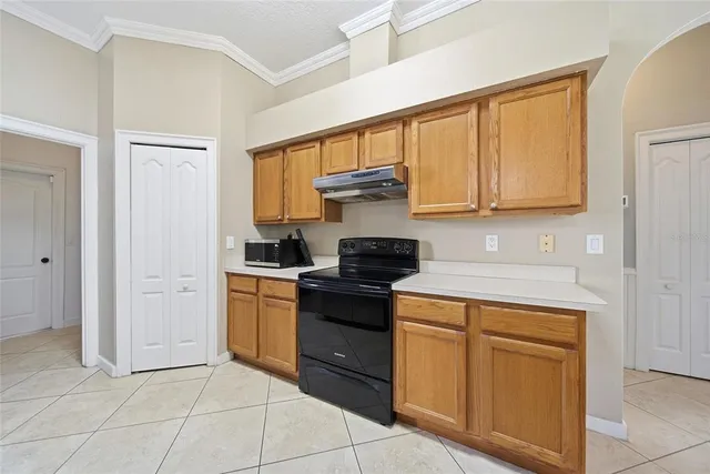 a kitchen with cabinets and appliances