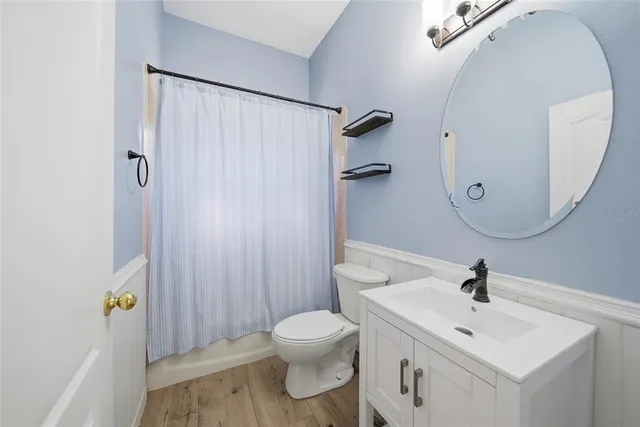 a bedroom with a bed and a flat tv screen