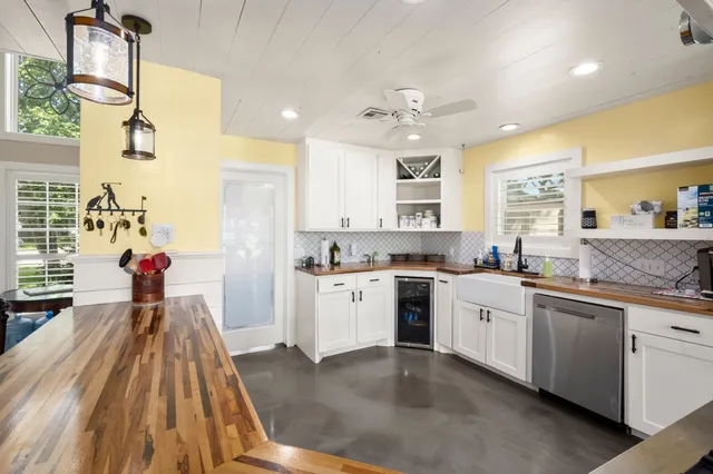 a kitchen with stainless steel appliances a stove sink and cabinets