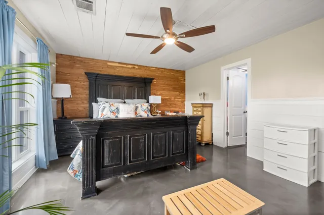 a spacious bathroom with a granite countertop sink a toilet and shower