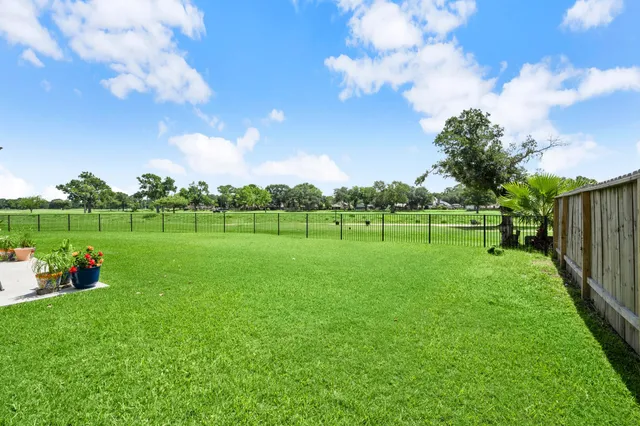 a view of a swimming pool and lounge chair
