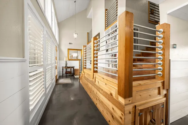 a dining room with wooden floor and furniture