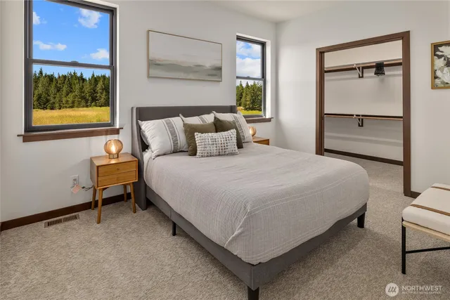 a bedroom with a bed and window