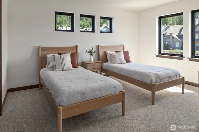 a bedroom with bed and night stand