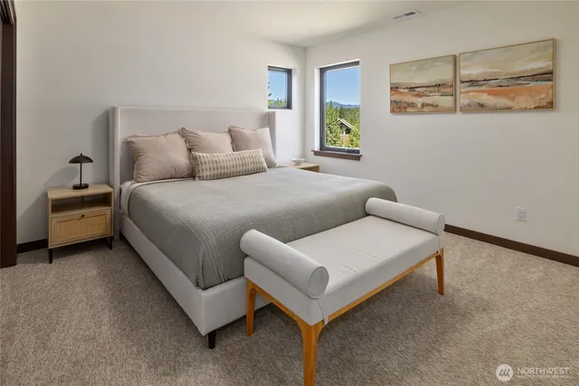 a bedroom with a bed and a couch