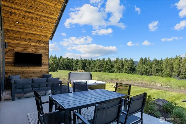 a view of an outside dining space with furniture