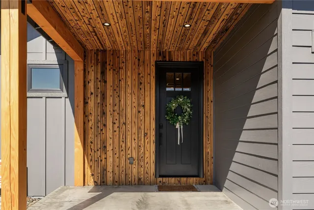 a view of a entryway door with wooden floor