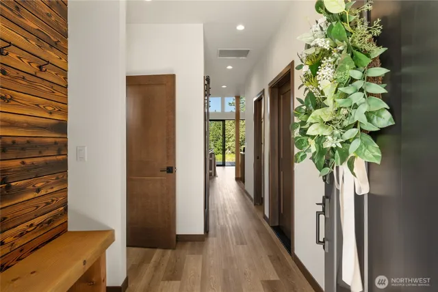 a view of hallway with wooden floor
