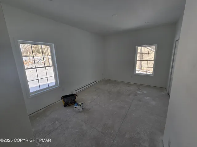 a room with gym equipment and a window