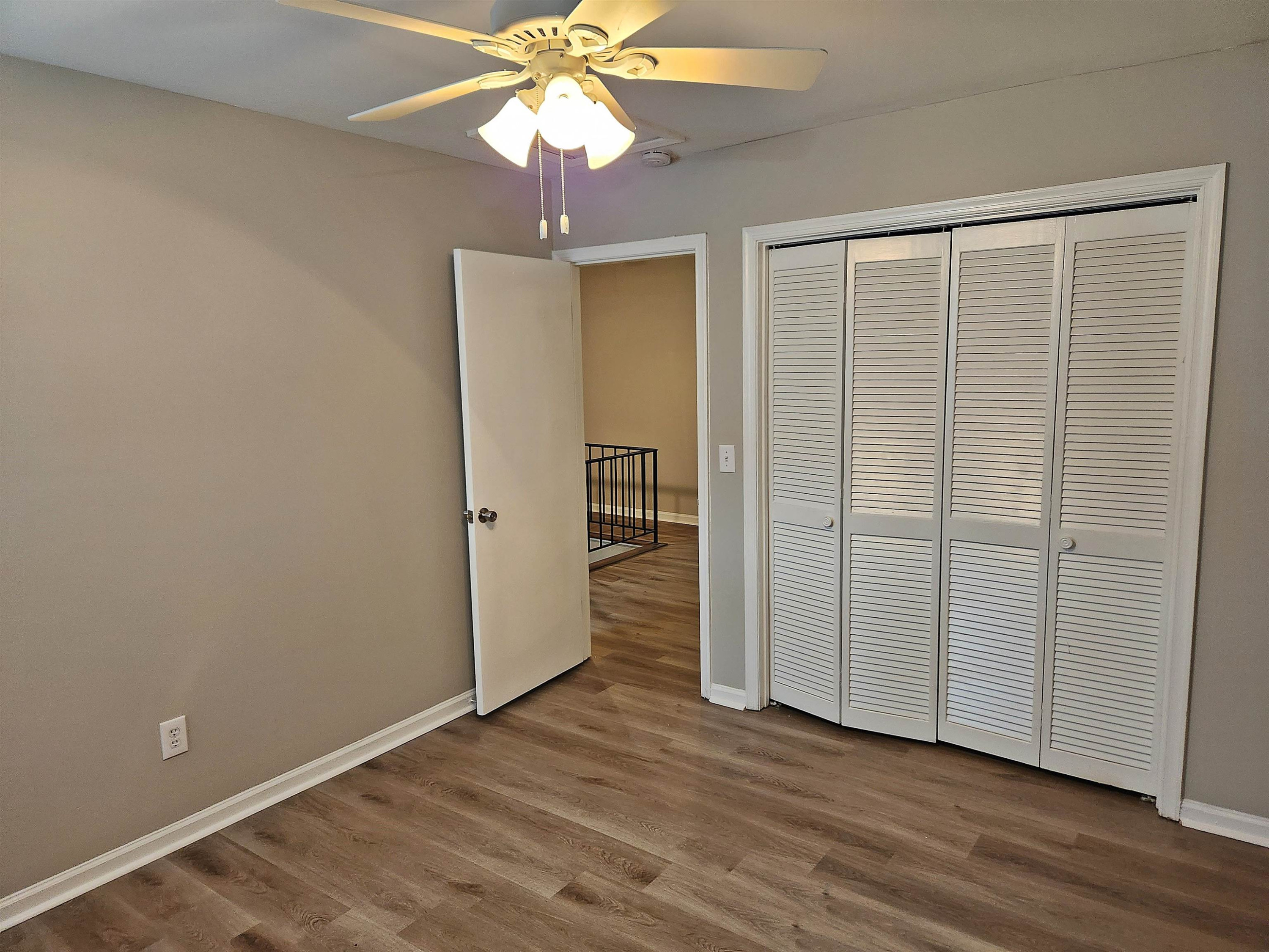 1227 Seaton Road, Unit 66 Durham, NC 27713 - Photo 21 of 29 an empty room with wooden floor closet and windows
