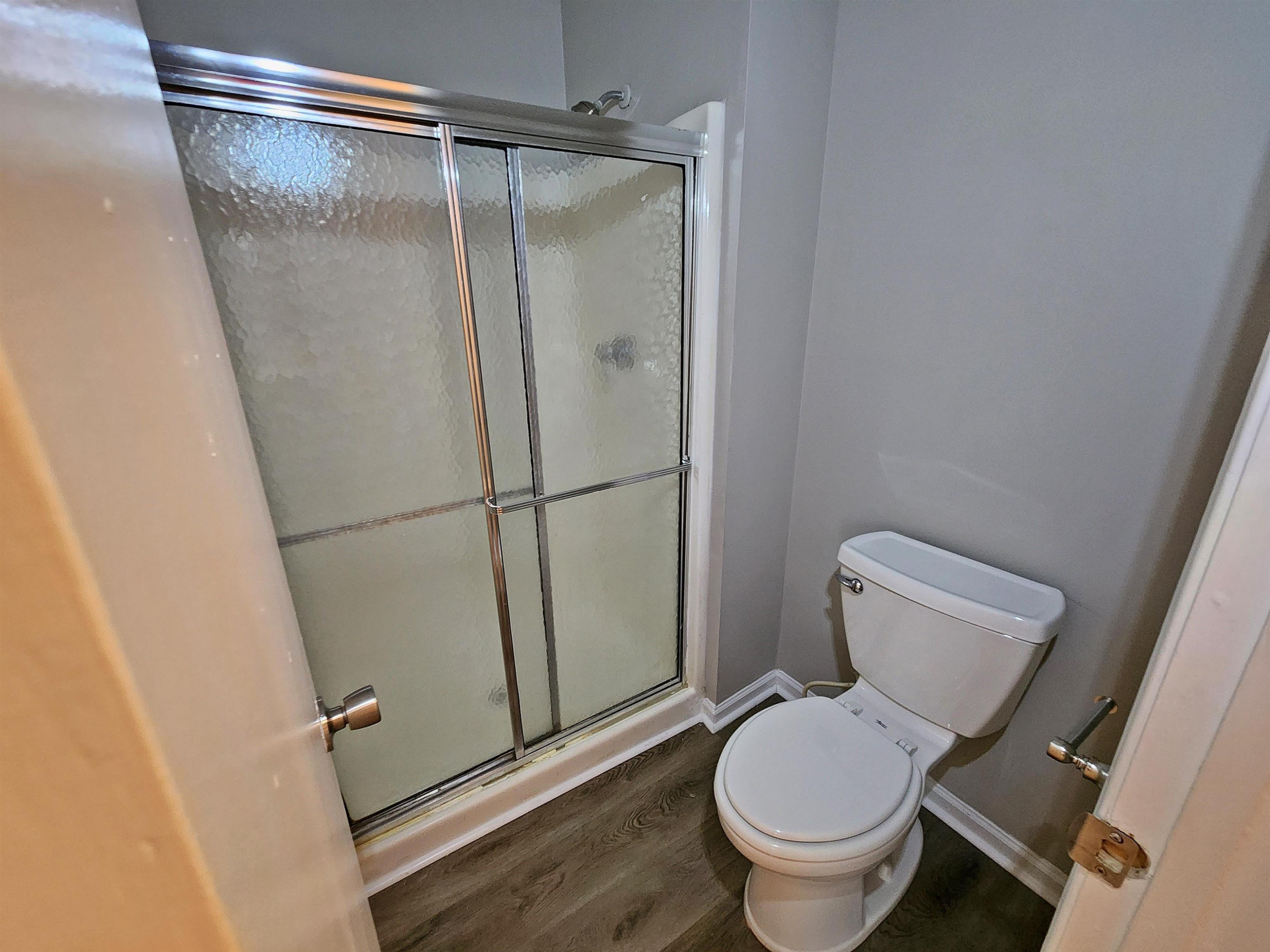 1227 Seaton Road, Unit 66 Durham, NC 27713 - Photo 27 of 29 a white toilet sitting next to a shower