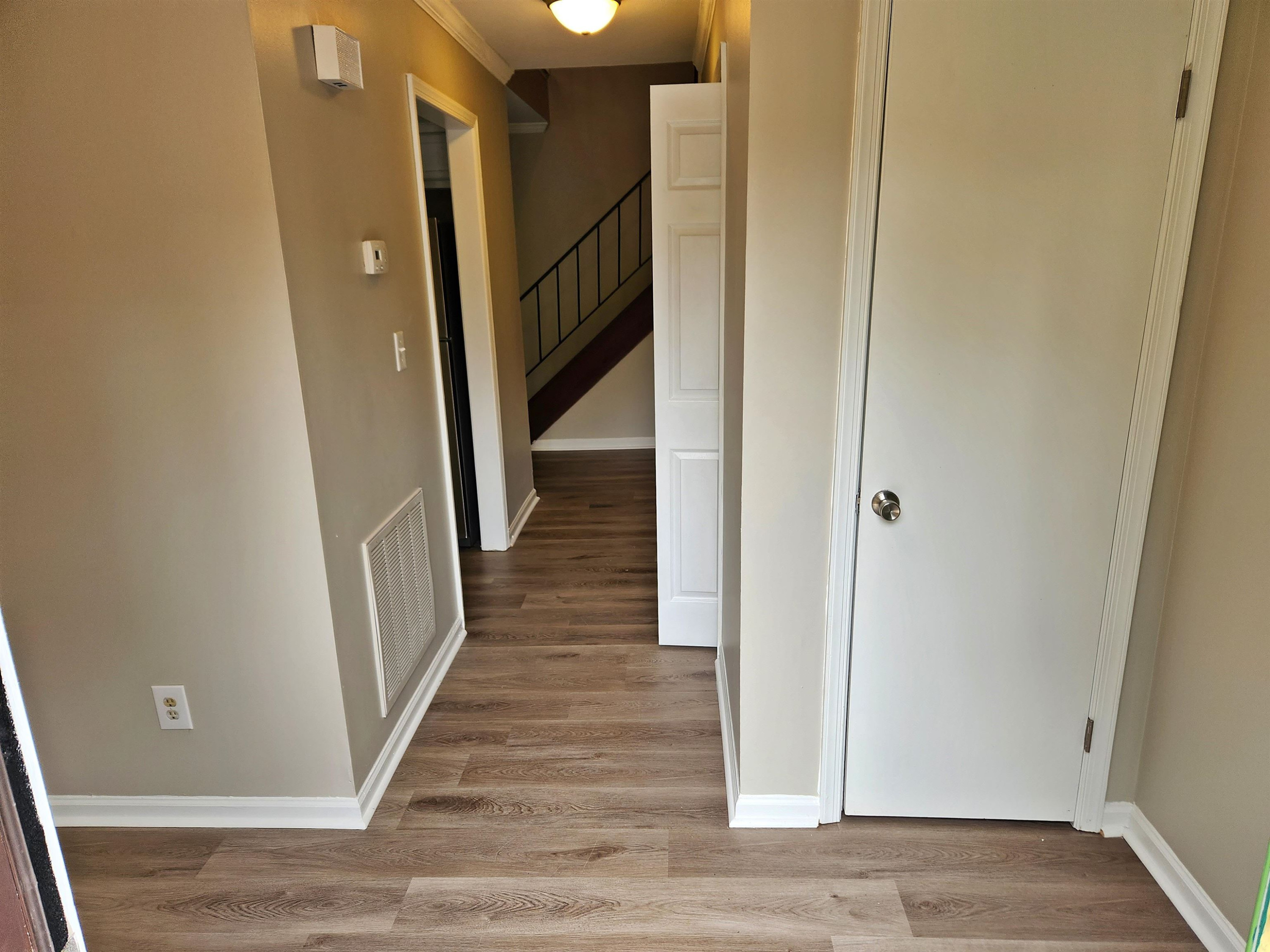 1227 Seaton Road, Unit 66 Durham, NC 27713 - Photo 5 of 29 a view of a hallway with wooden floor and staircase
