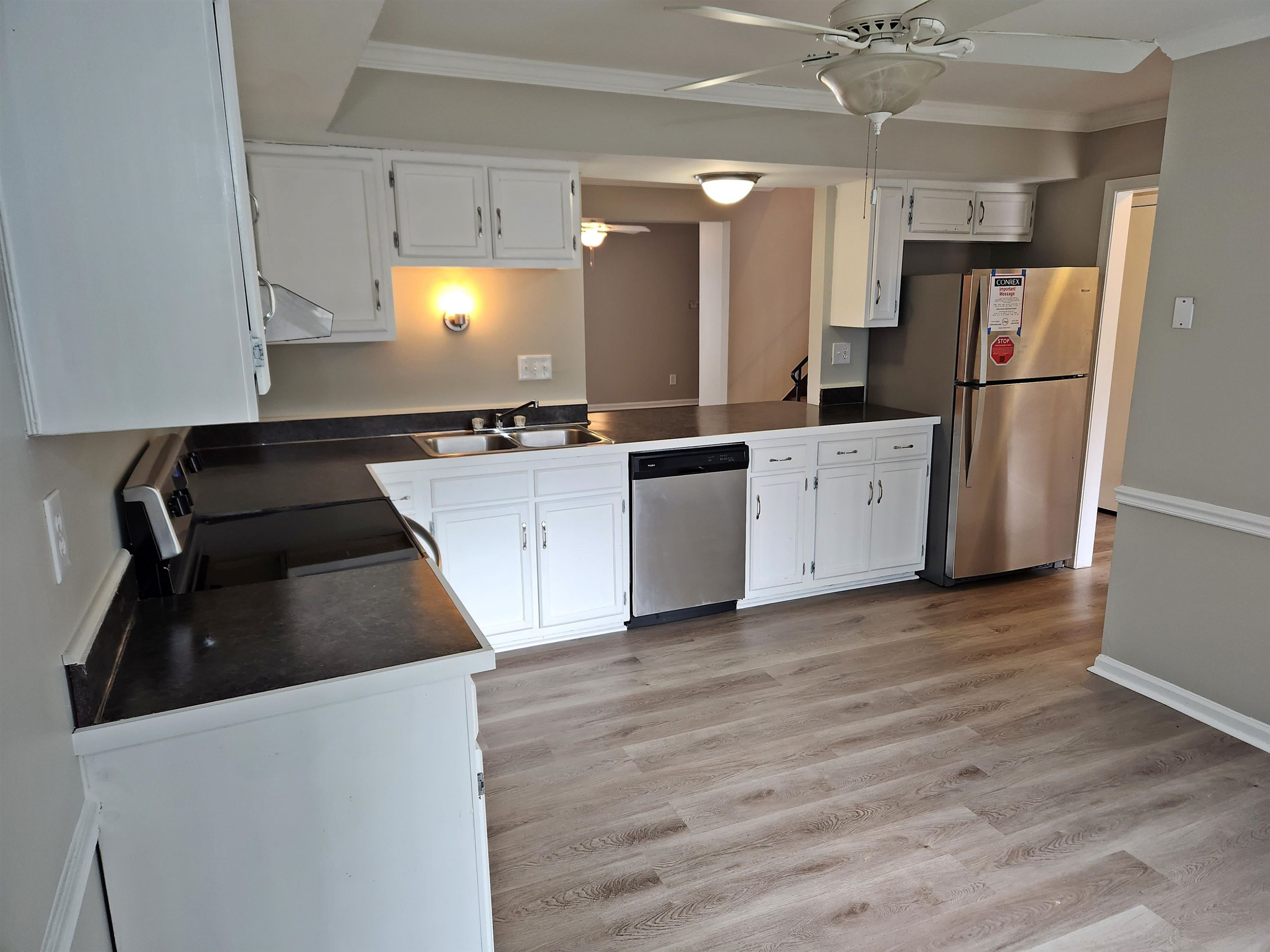 1227 Seaton Road, Unit 66 Durham, NC 27713 - Photo 8 of 29 a kitchen with granite countertop a refrigerator and a stove