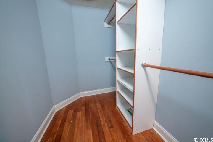 936 Oak Ridge Place Myrtle Beach, SC 29572 - Photo 26 of 36 Walk in closet featuring dark wood-style floors