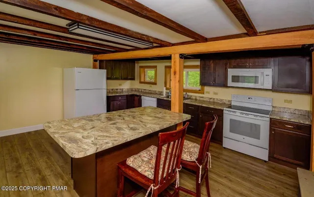 a kitchen with a stove and a refrigerator