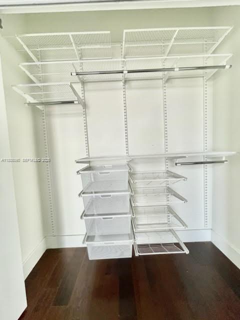 7187 Northwest 103rd Path Doral, FL 33178 - Photo 16 of 20 a view of walk in closet with empty racks