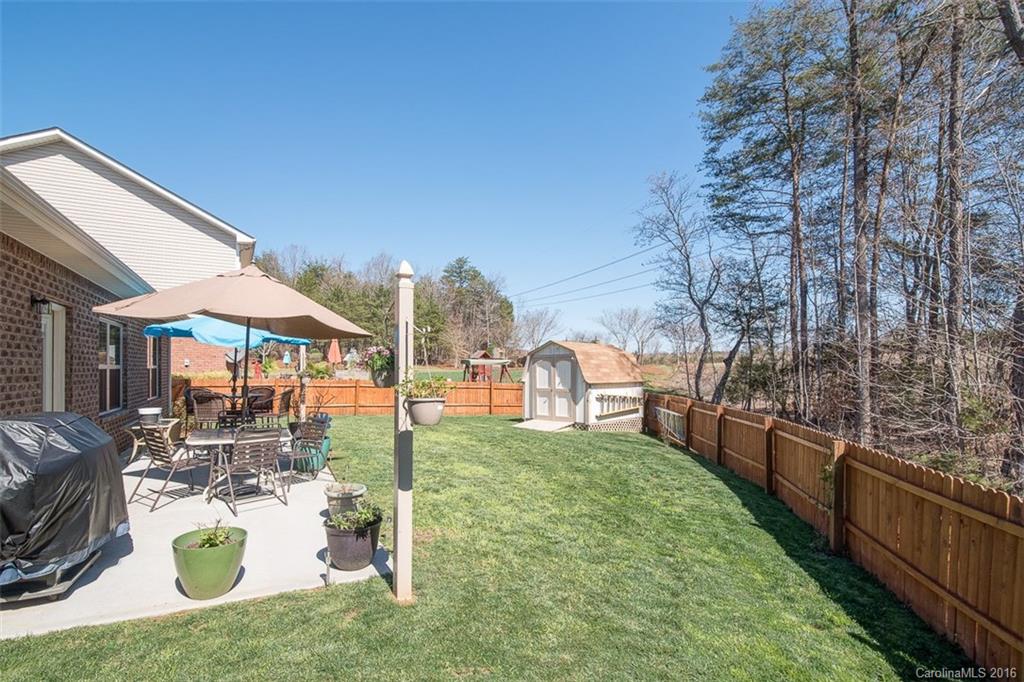 1752 Newland Road Denver, NC 28037 - Photo 13 of 15 a view of swimming pool with outdoor seating and a garden