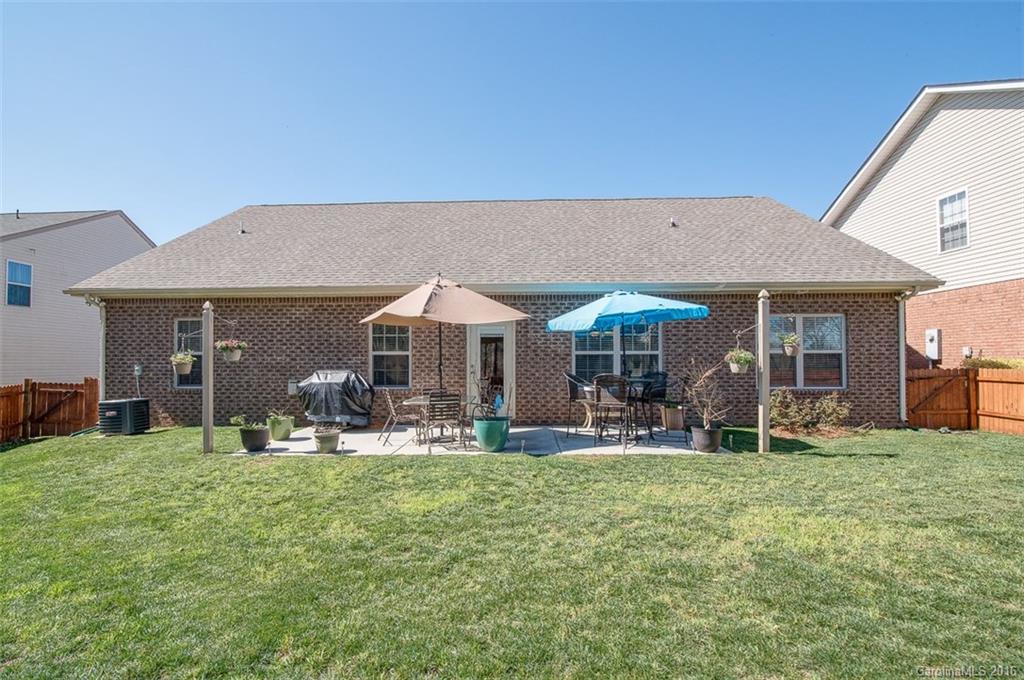 1752 Newland Road Denver, NC 28037 - Photo 14 of 15 a backyard of a house with table and chairs