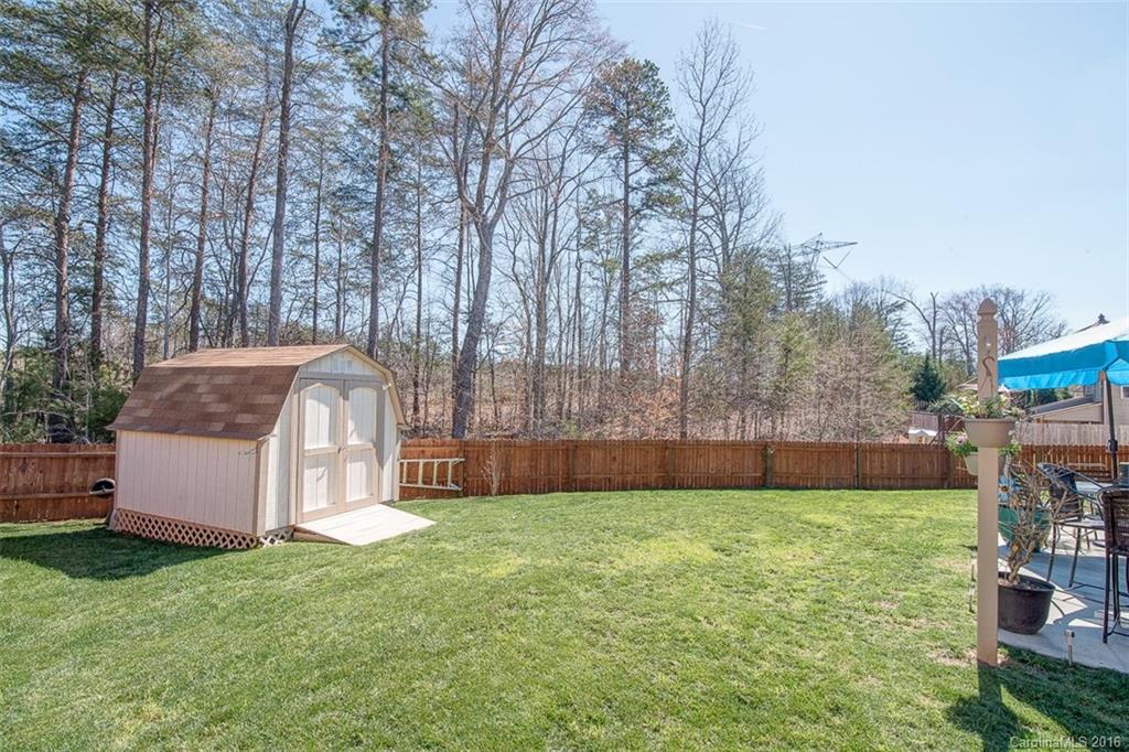 1752 Newland Road Denver, NC 28037 - Photo 15 of 15 a swimming pool with outdoor seating and yard