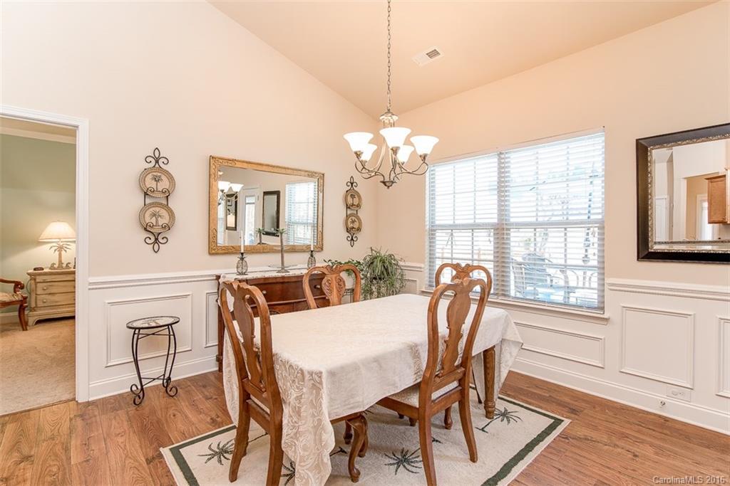 1752 Newland Road Denver, NC 28037 - Photo 4 of 15 a view of a dining room with furniture window and wooden floor