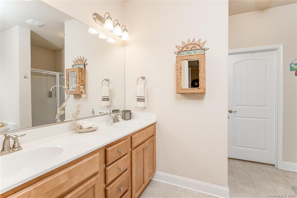1752 Newland Road Denver, NC 28037 - Photo 7 of 15 a bathroom with a double vanity sink mirror and